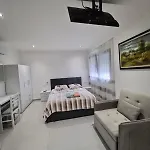 Aj *